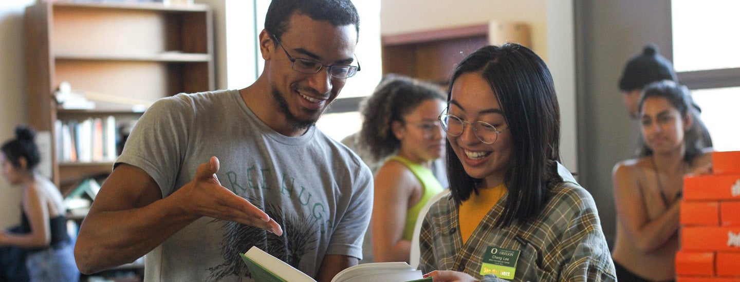 Students share a book at the Multicultural Center